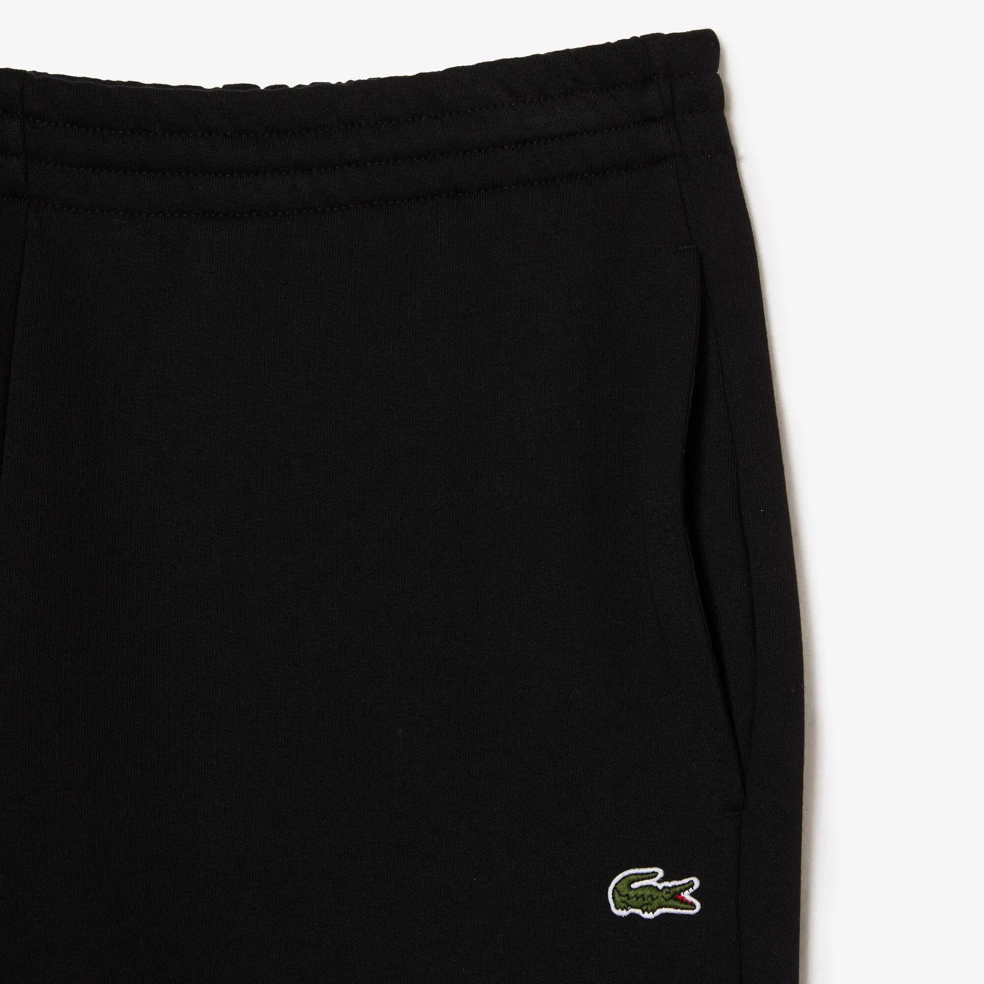 Spodnie dresowe bawełniane Lacoste 6/7