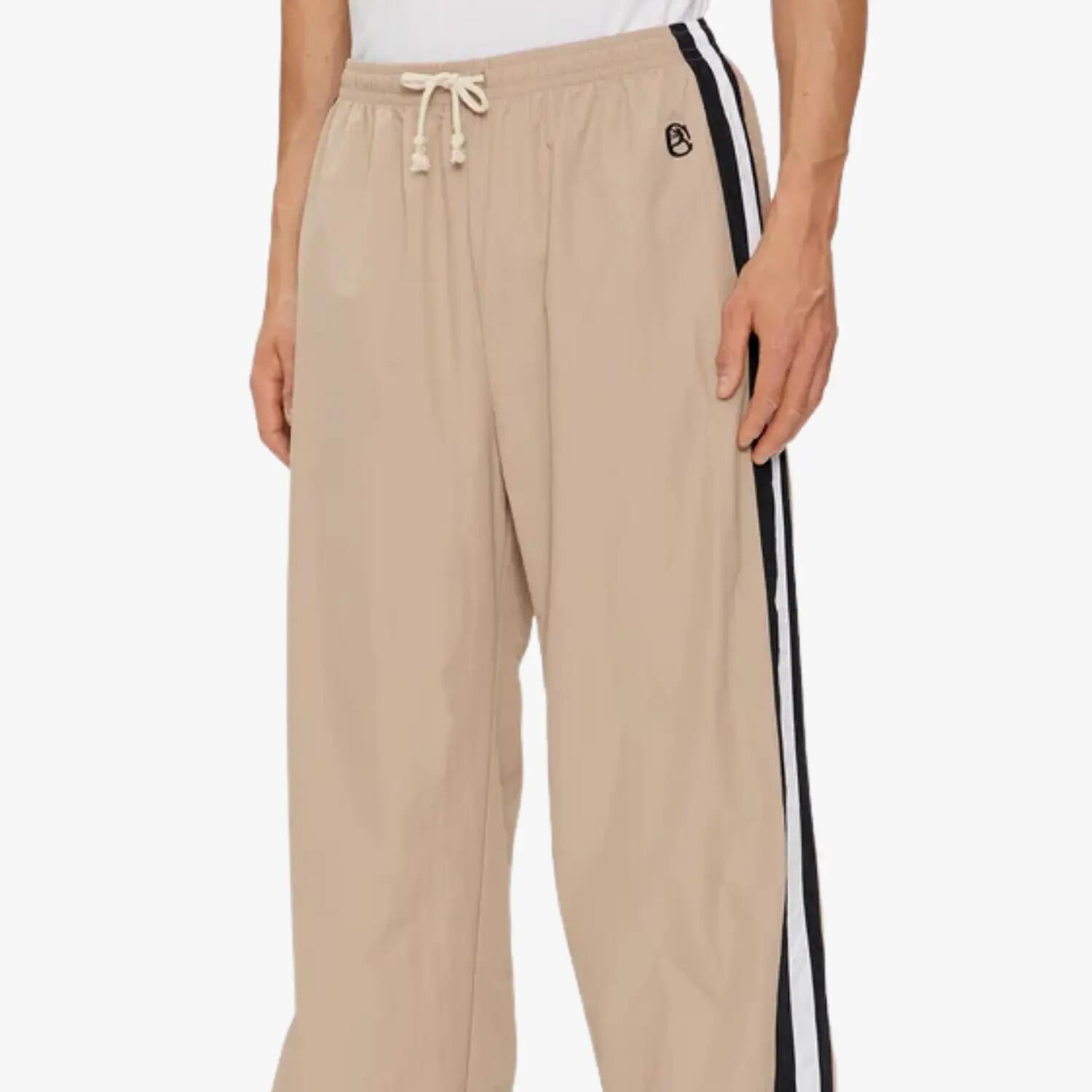 Pantaloni unisex cu manșetă elastică Champion Bej