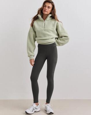 Dames sportlegging verwarmend met zakken donkerklimop