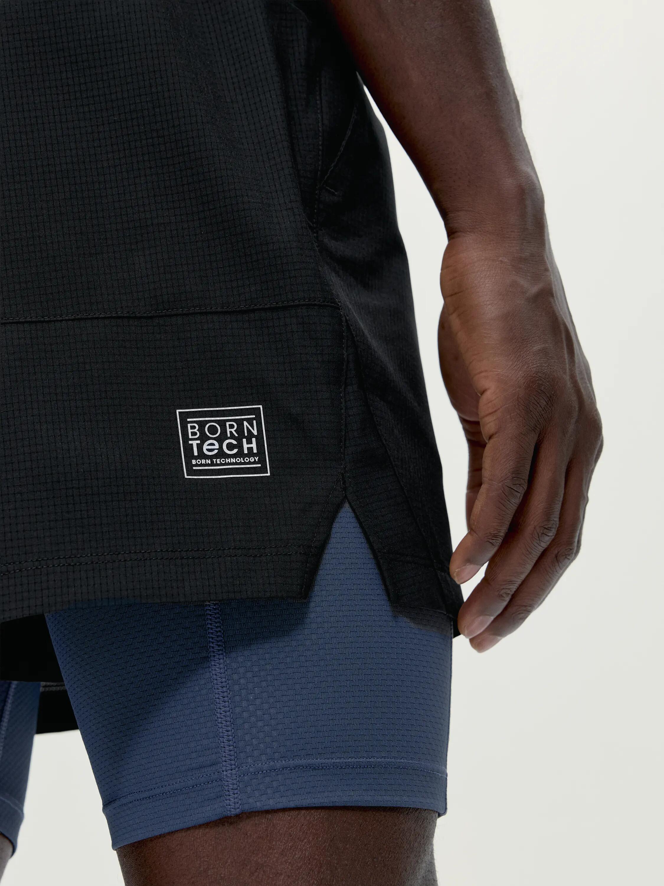 Pantalón corto deportivo de hombre Strider 2 en 1 con bolsillos 3/6