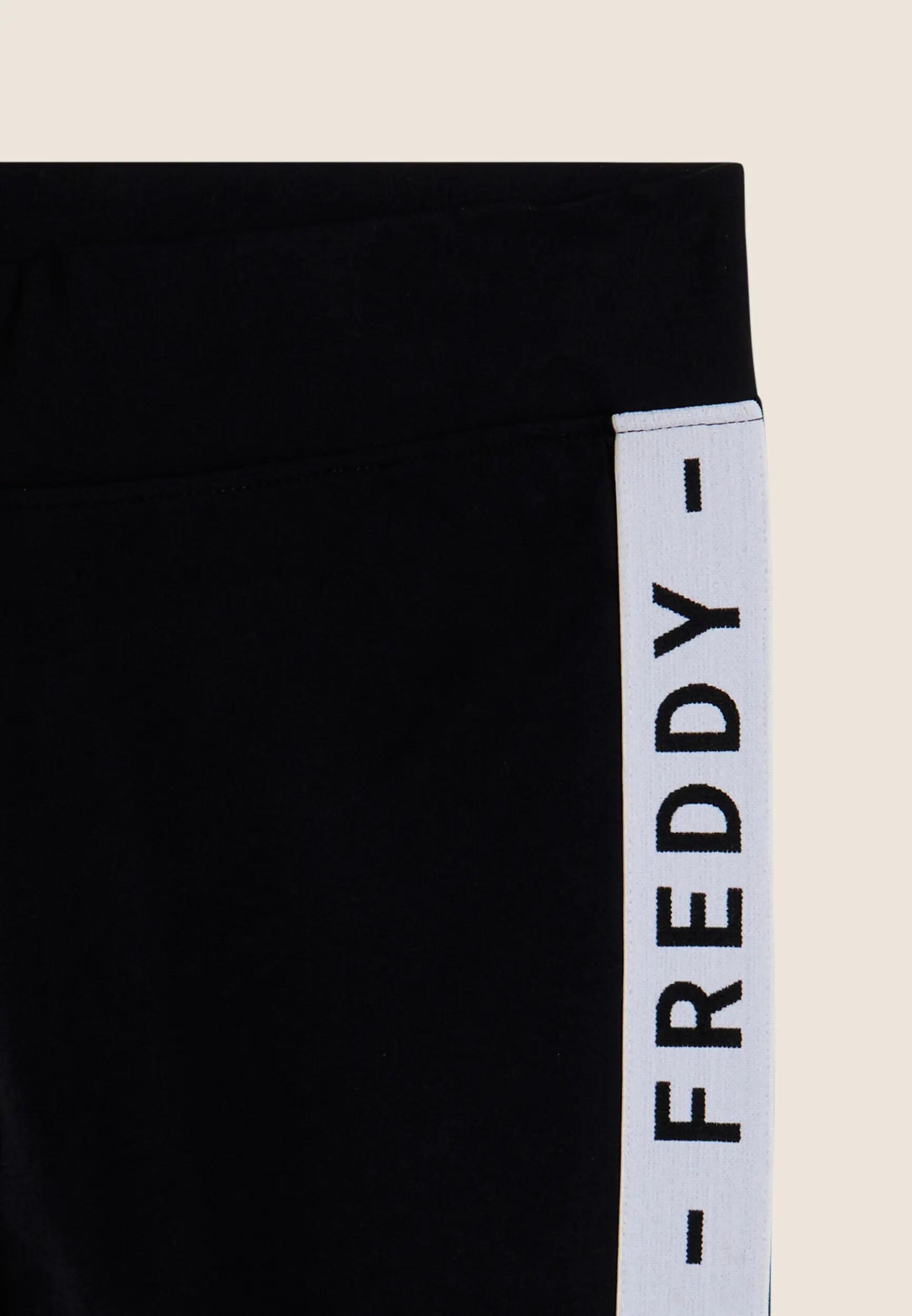 Leggings con tiras laterales y la inscripción FREDDY MST 6/6