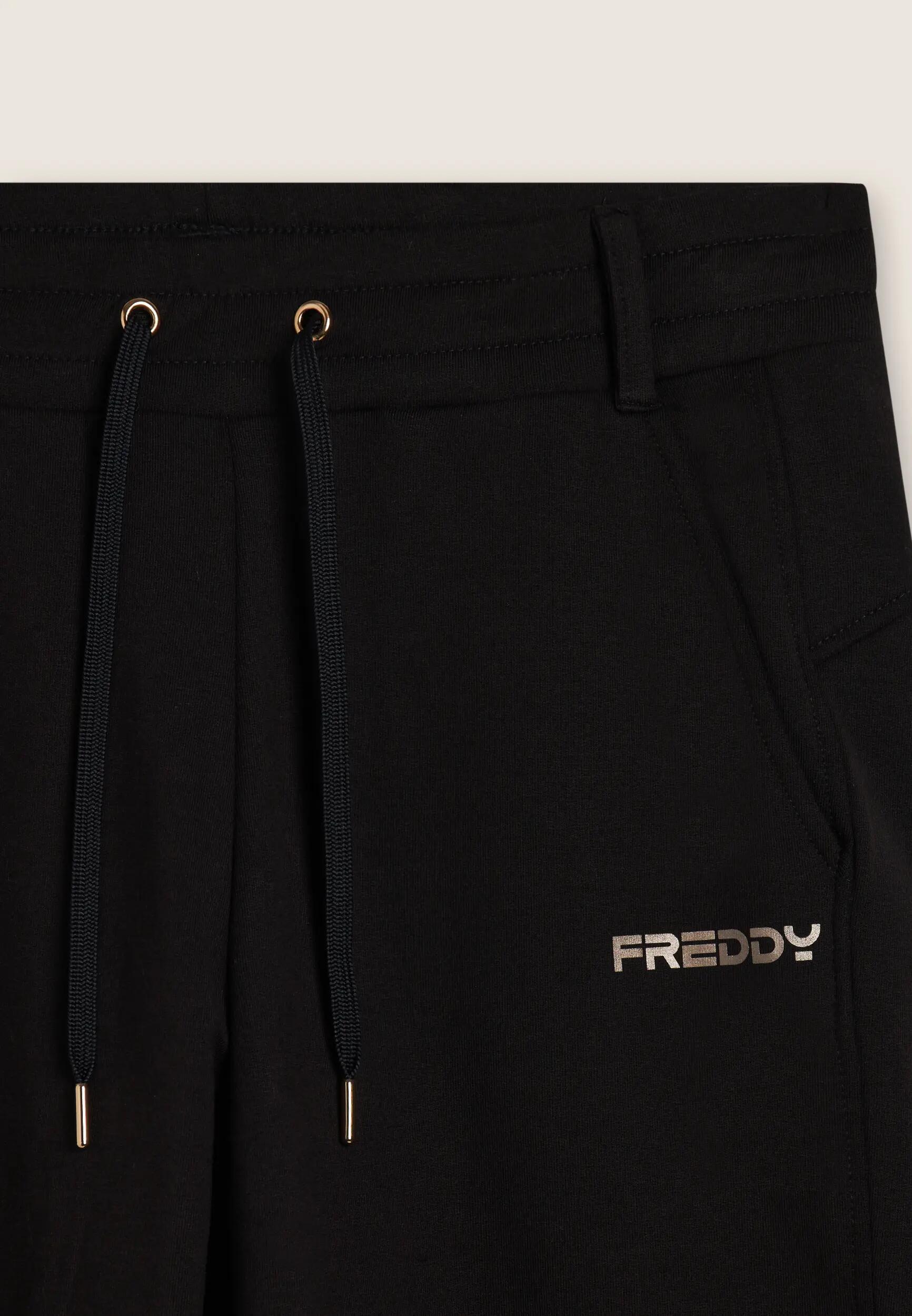 Pantalón slim fit con aberturas laterales 6/6