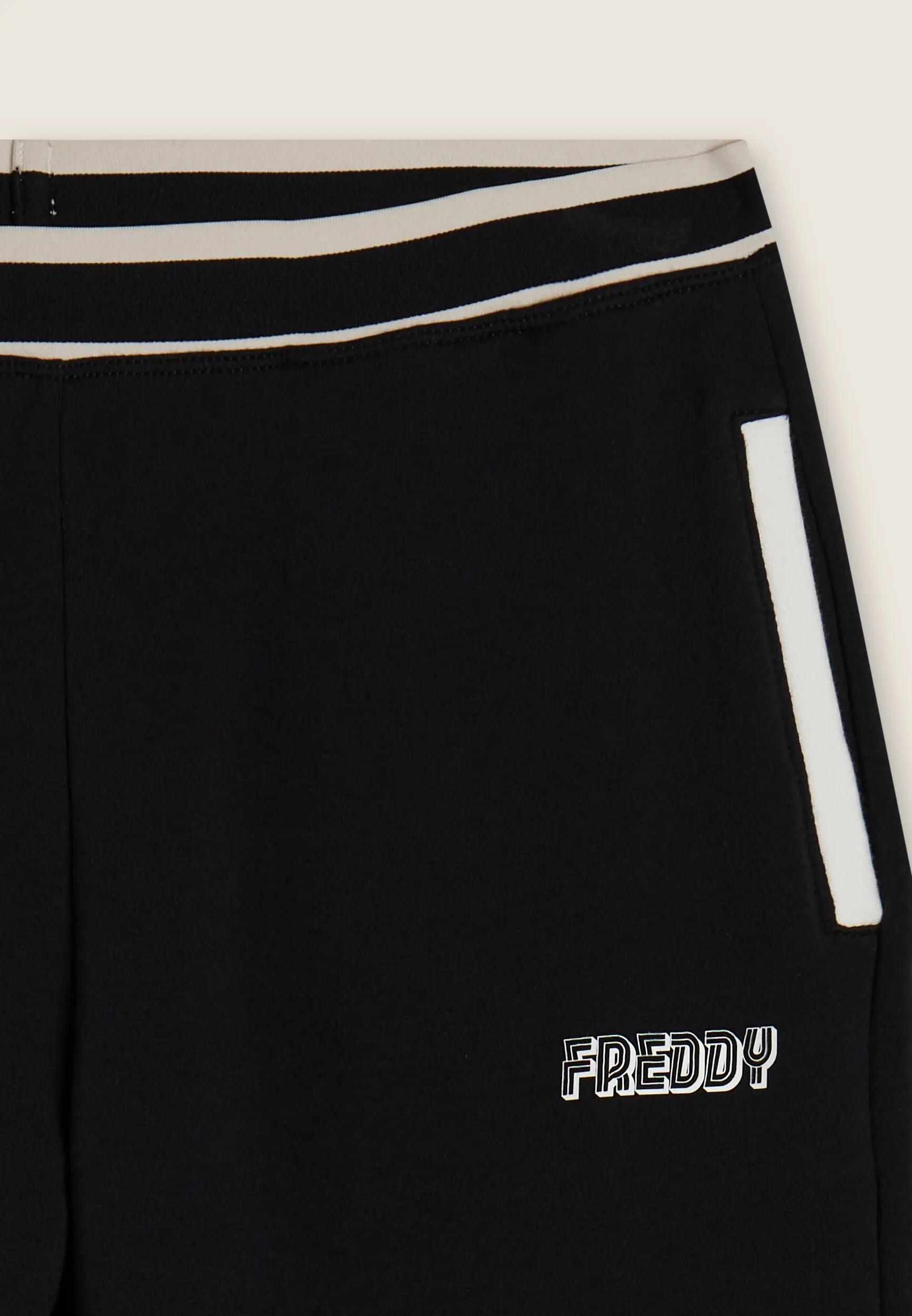 Pantalón regular en felpa con detalles de rayas 6/6