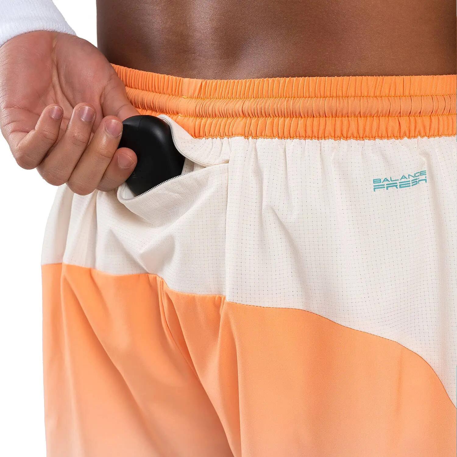 Pantalón corto deportivo hombre PRO naranja NOX 4/5