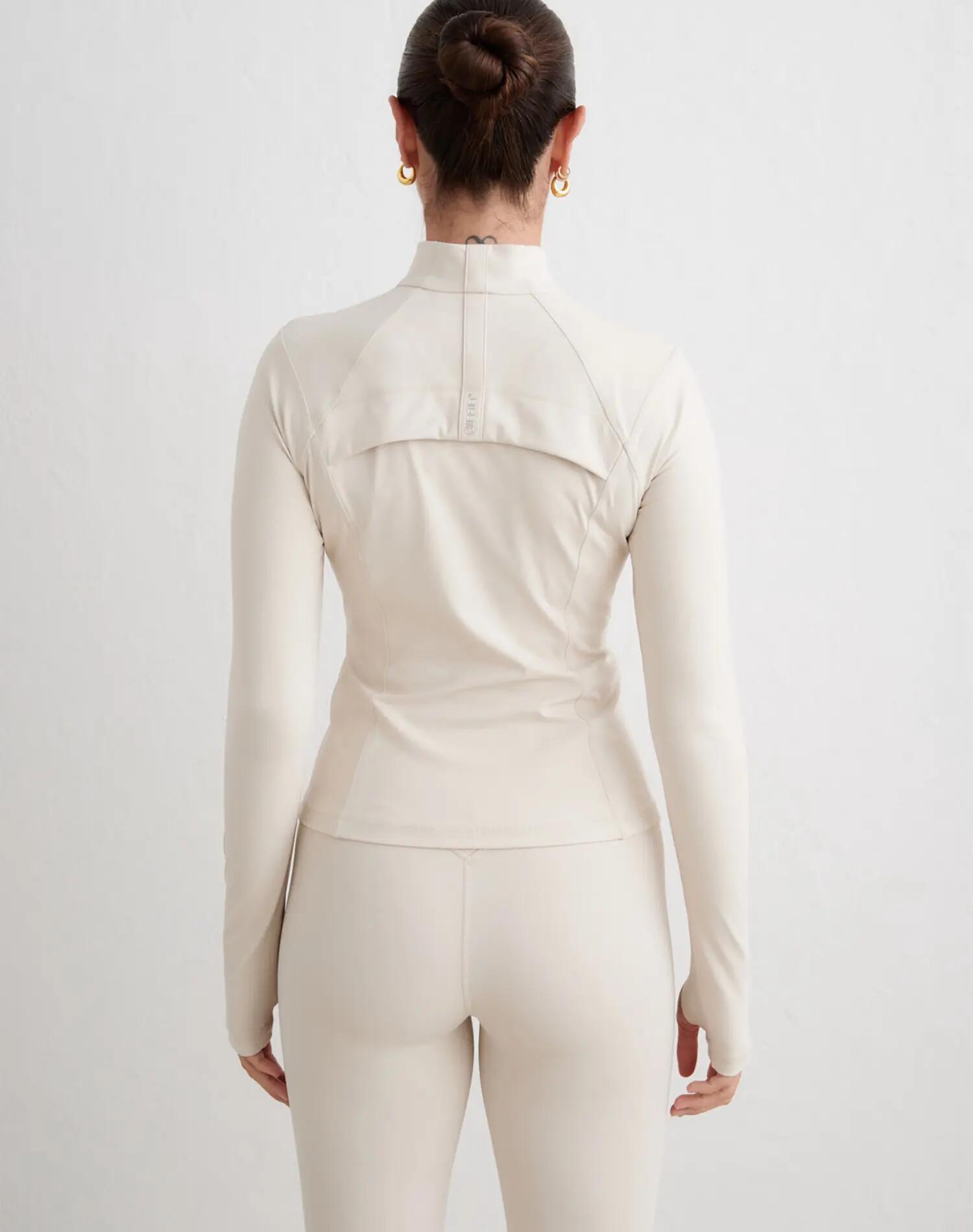 Dames sportjack compressie met rits vormgevend zand 2/5
