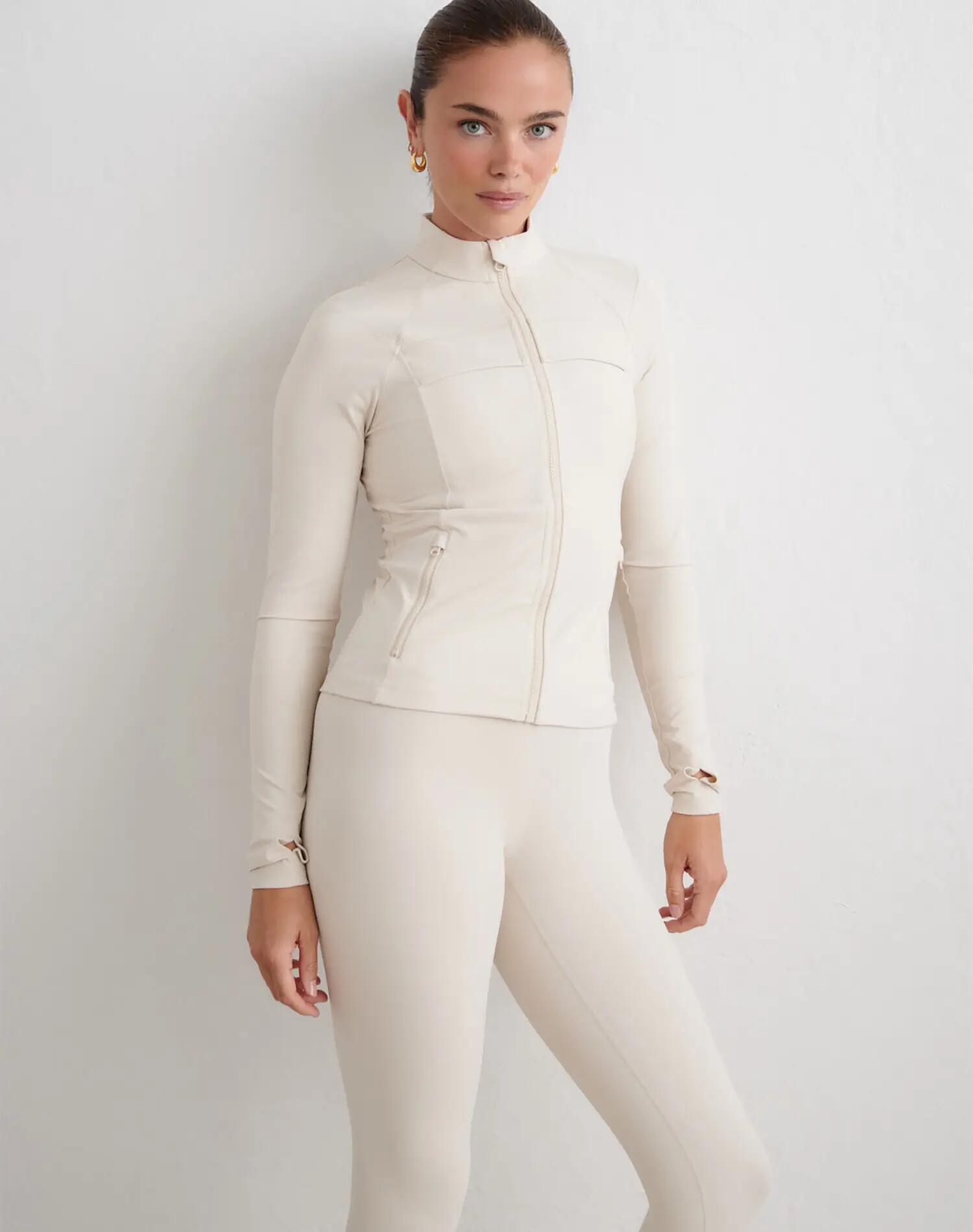 Dames sportjack compressie met rits vormgevend zand 5/5