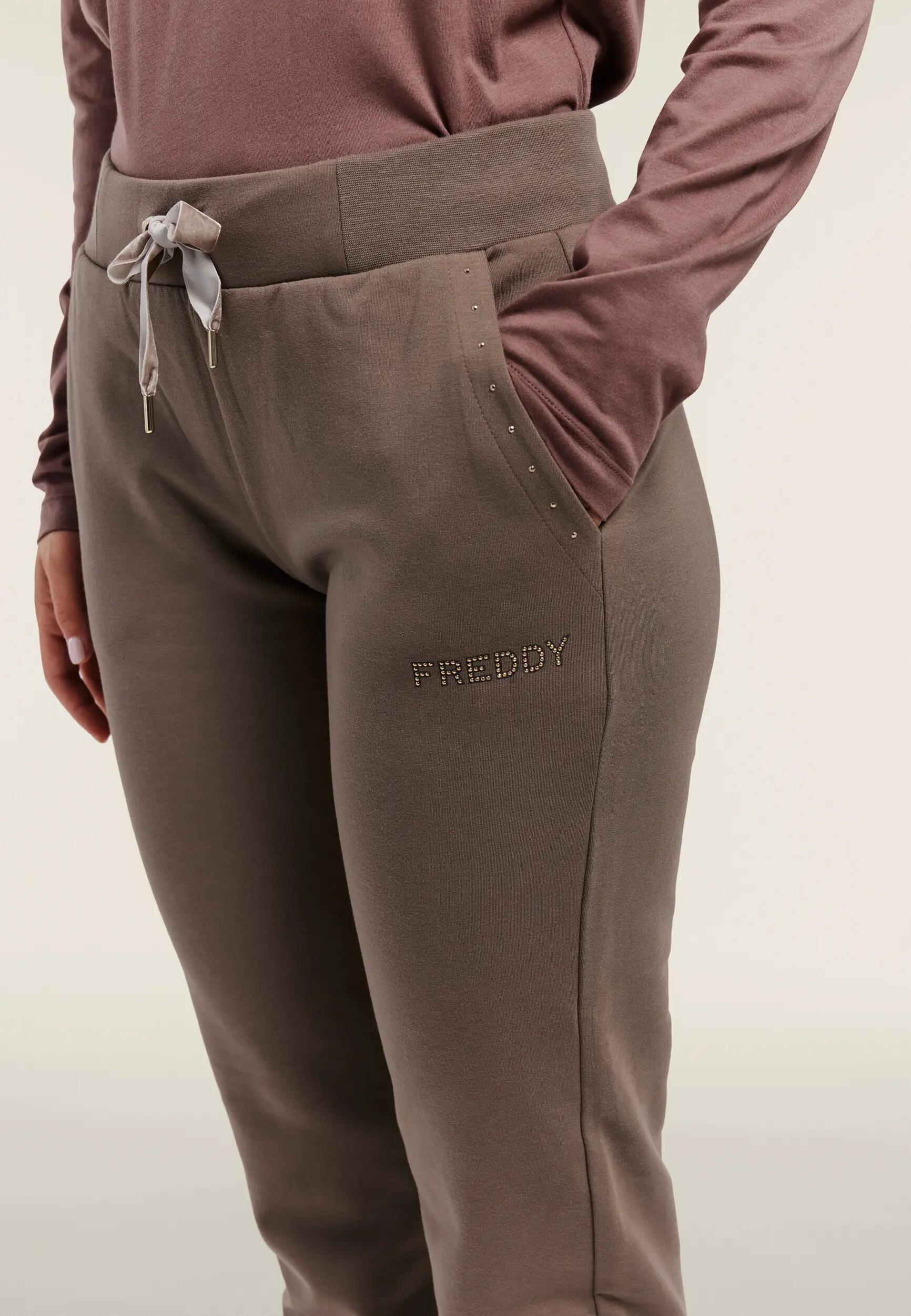Dames sportbroek met studs op de zakken en logo 4/6