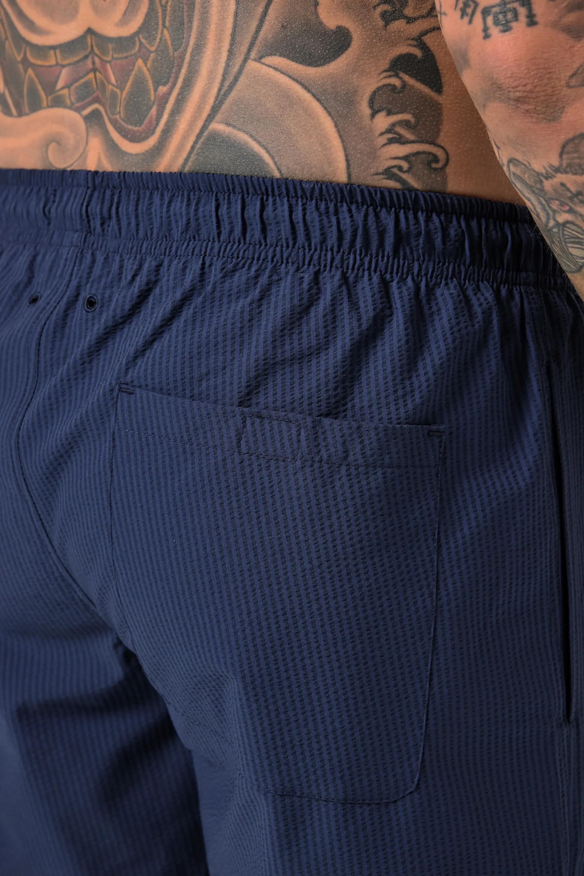 Hommes Short de bain en tissu seersucker texturé collection Beachwear 8/11