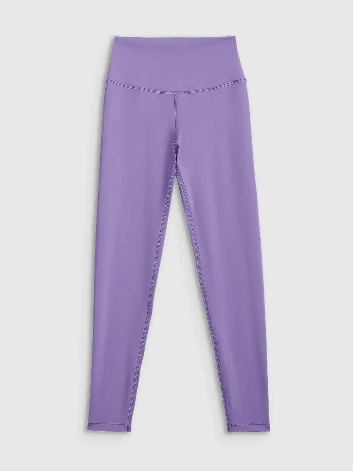 LEGGINSY DAMSKIE 4F TENINGOWE SZYBKOSCHNĄCE Z WYSOKIM STANEM KOLOR FIOLETOWY 12/14
