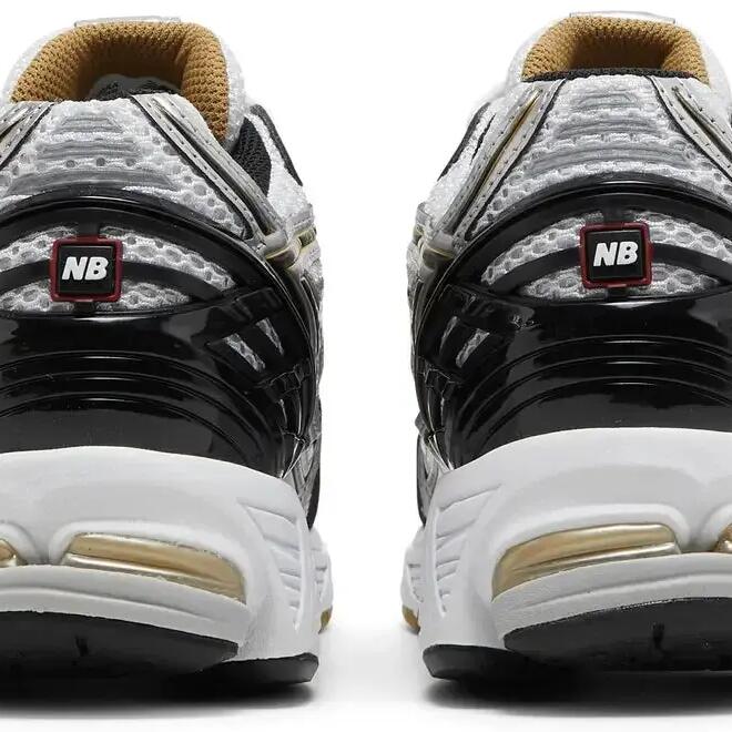 New Balance 1906R Metallic Silver running-inspired sneaker.