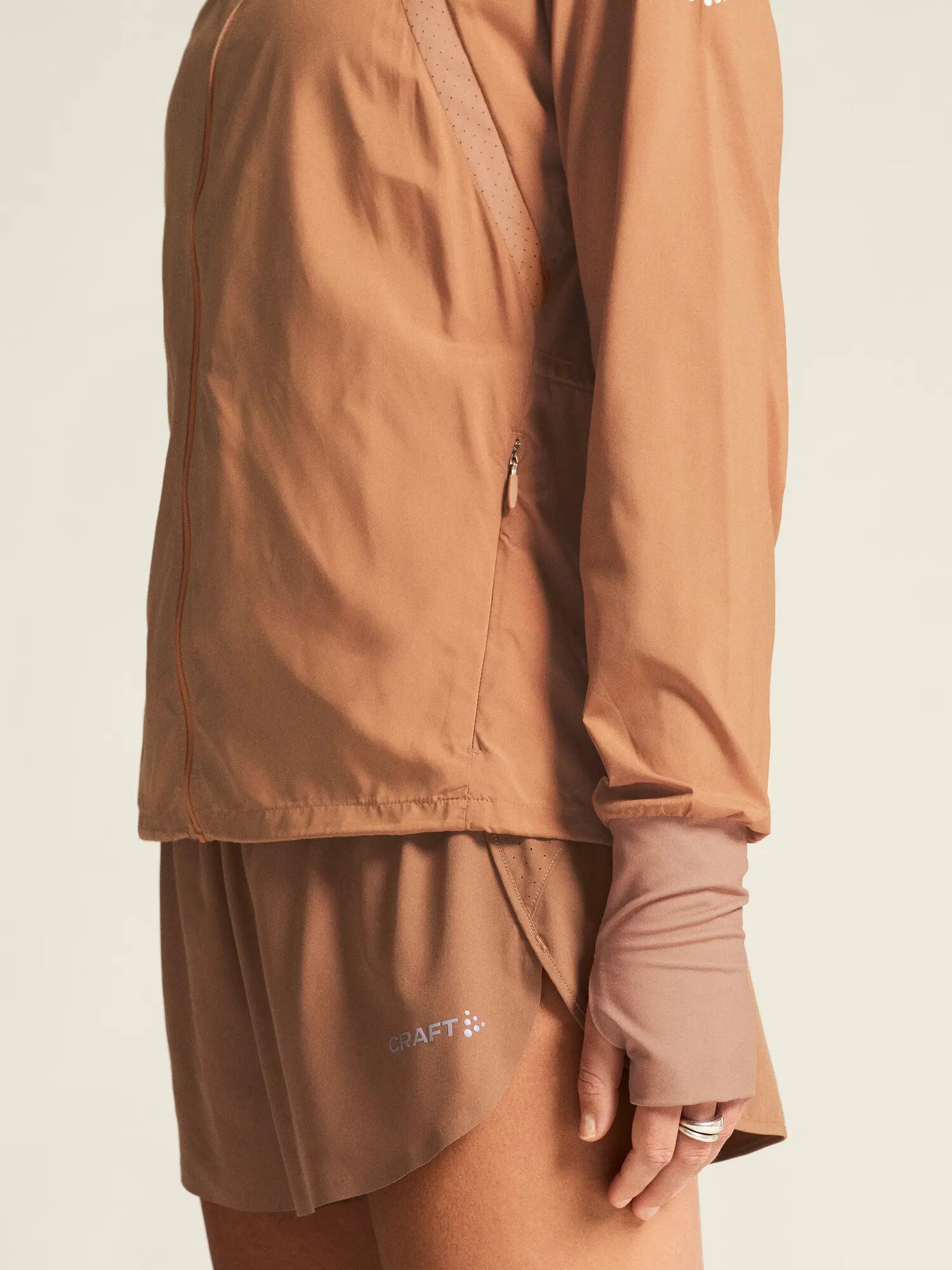 craft ADV Essence Wind Jacket Dames licht, wind- en waterafstotend – Syrup 6/7