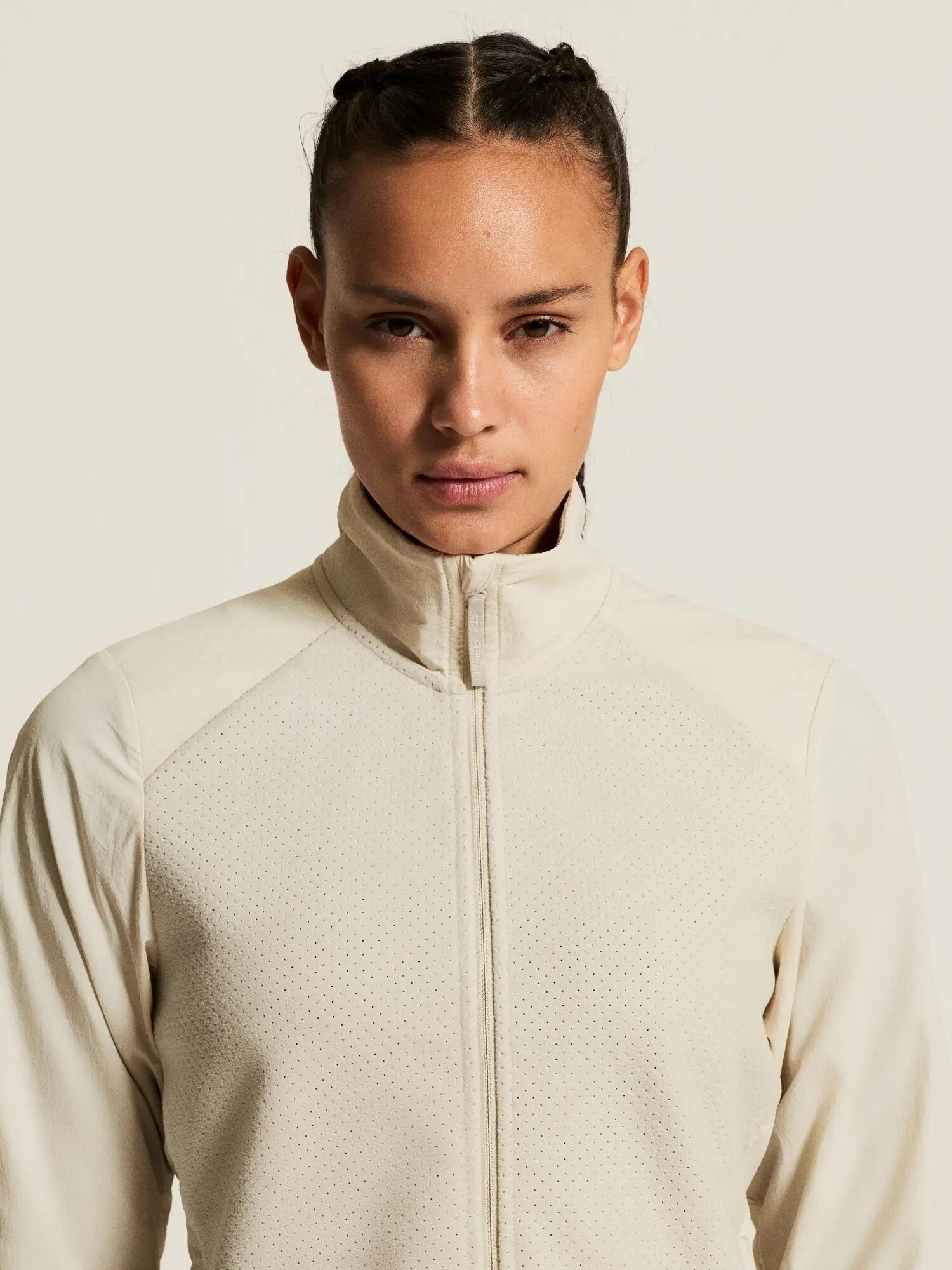 craft Fleece Jersey Jacket W — Jaqueta running quente com mangas corta‑vento – 6/7