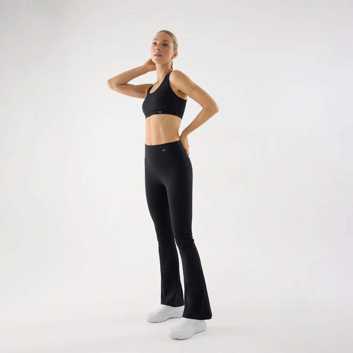 Leggings deportivos acampanados tacto algodonero negro 3/4