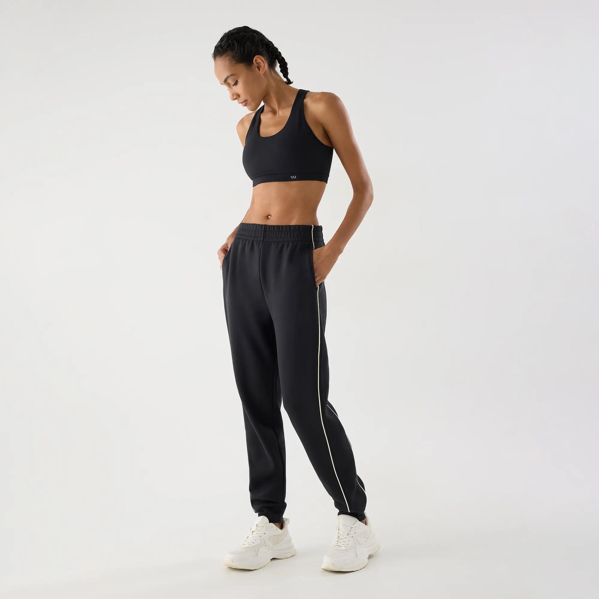 Calças jogger desportivas de mulher cinzento-antracite com bolsos e riscas em co 3/4
