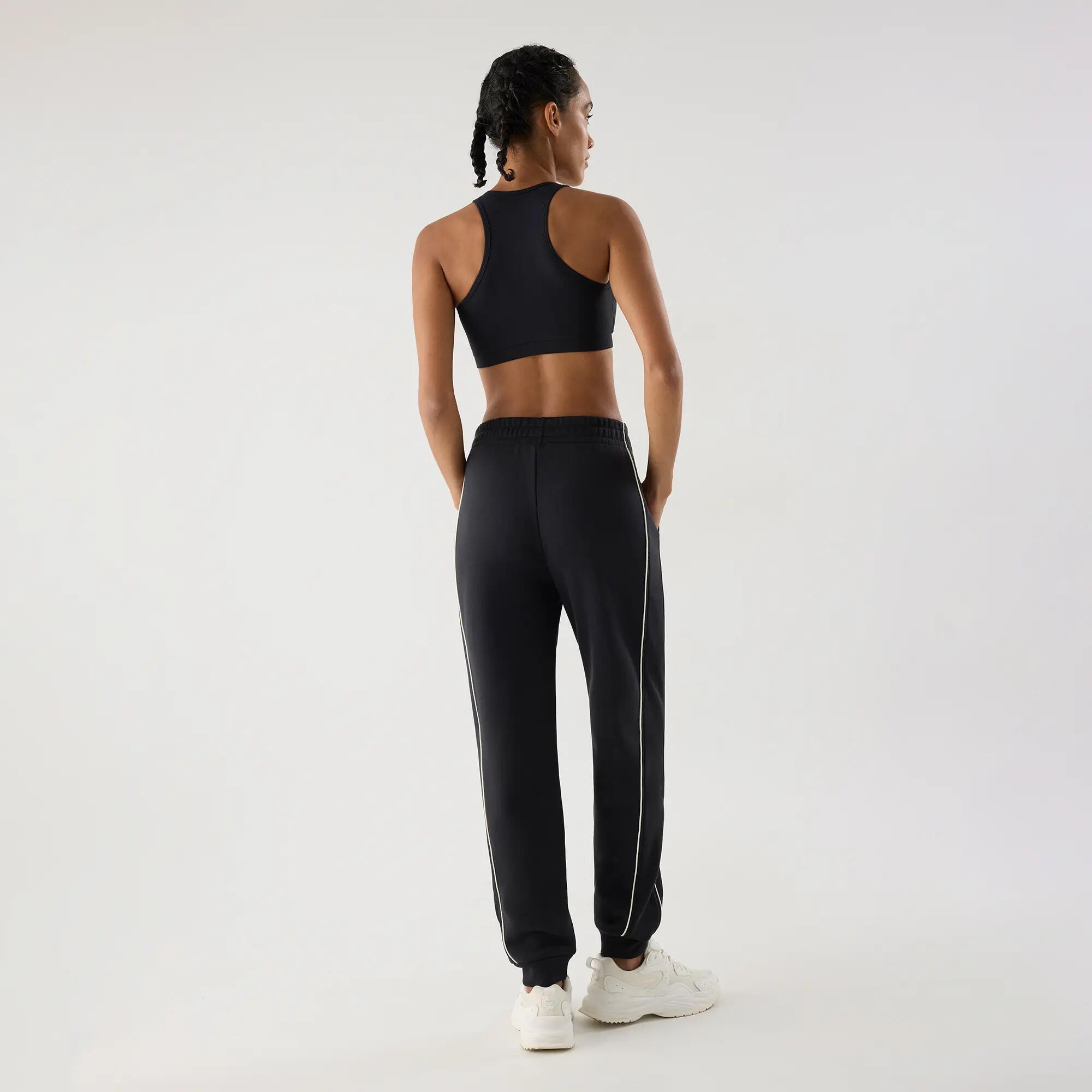 Calças jogger desportivas de mulher cinzento-antracite com bolsos e riscas em co 2/4