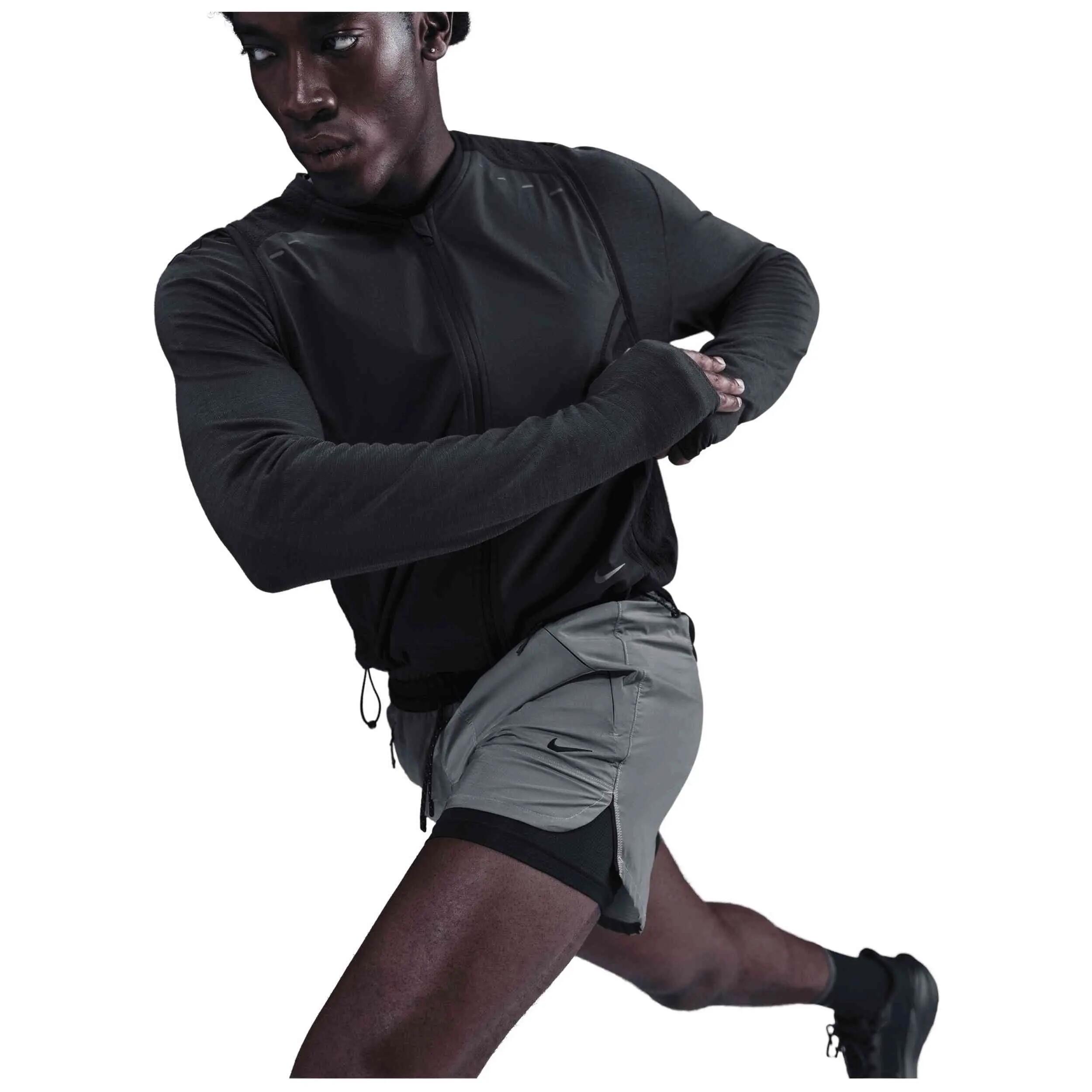 Pantaloncini Nike modello Shorts Nike 4" 2-IN-1 Reflective Running per donne 4/5