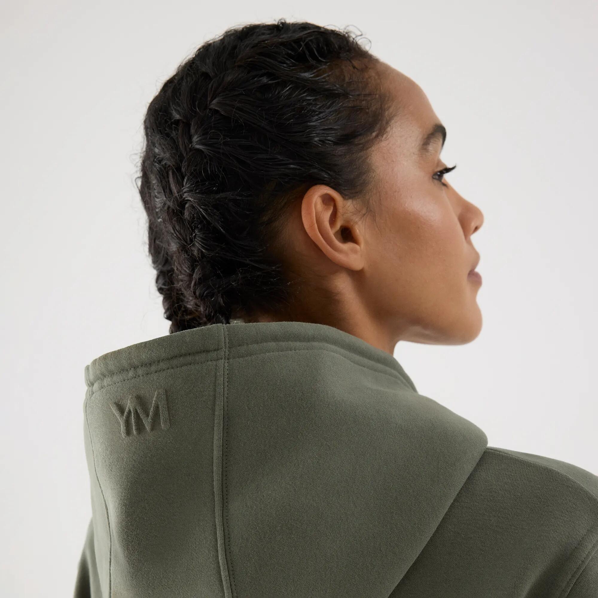 Sweatshirt desportiva de mulher verde cardada com capuz 4/6