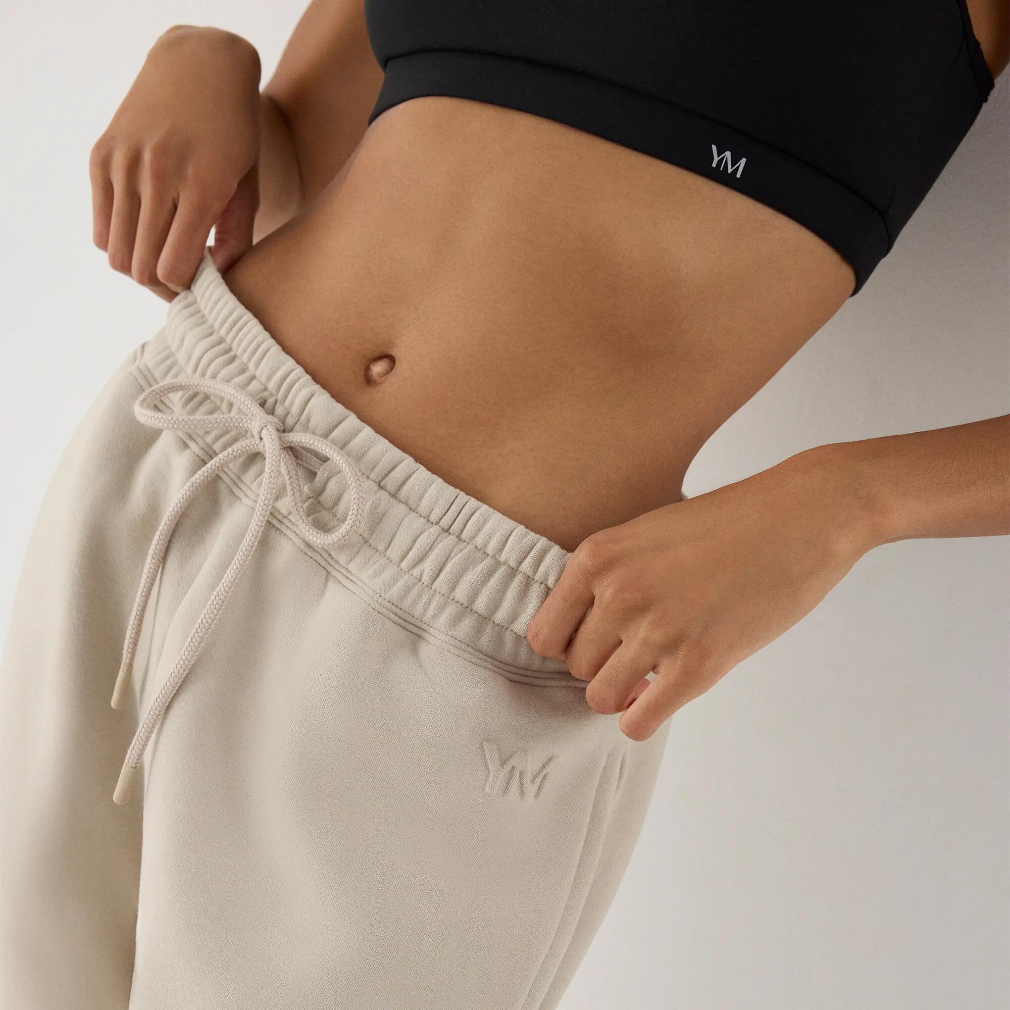 Calças jogger desportivas de mulher bege com cintura ajustável 4/5