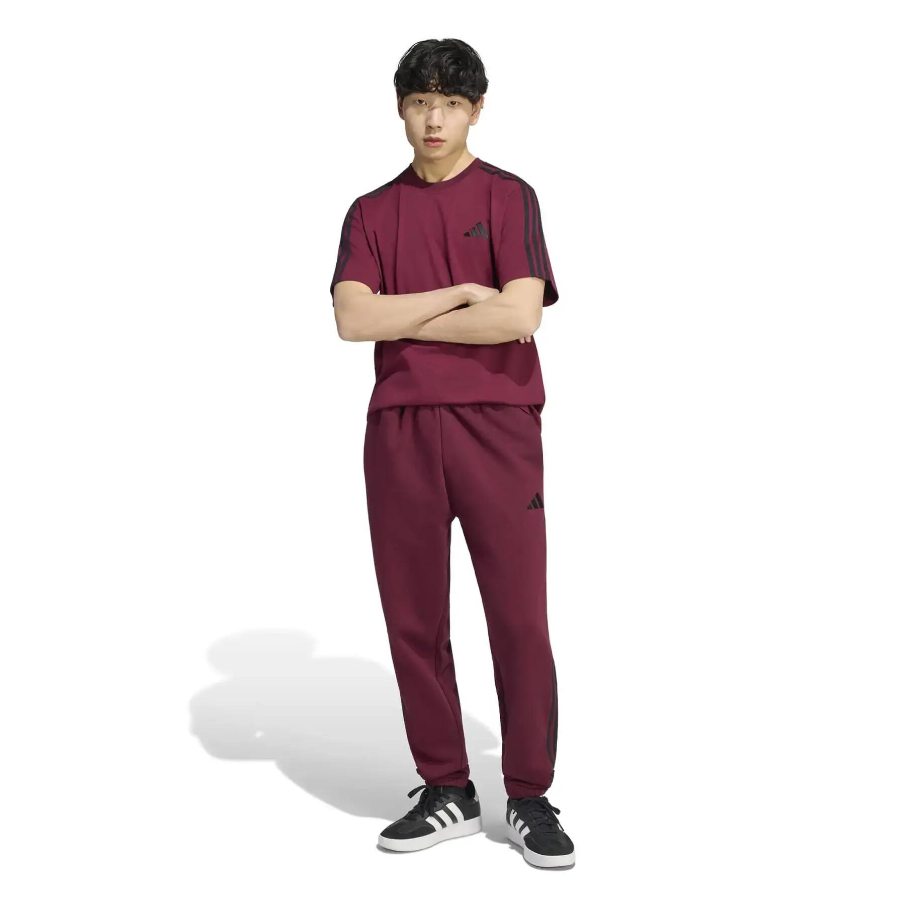 Pantaloni sportivi tapered adidas Essentials 3-Stripes Fleece Cuffed 3/6