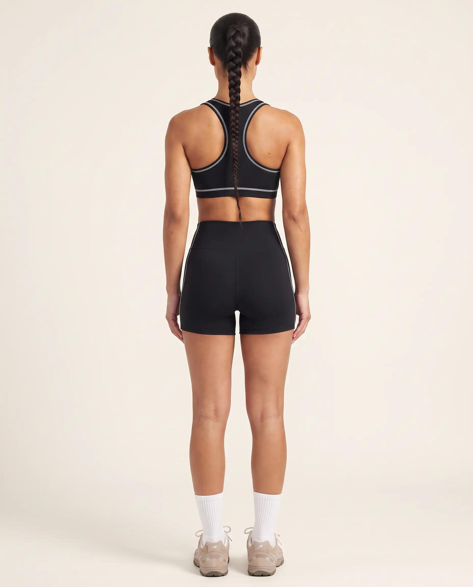Brassière de sport fitness femme dos nageur liseré contrasté Track - Noir 6/8
