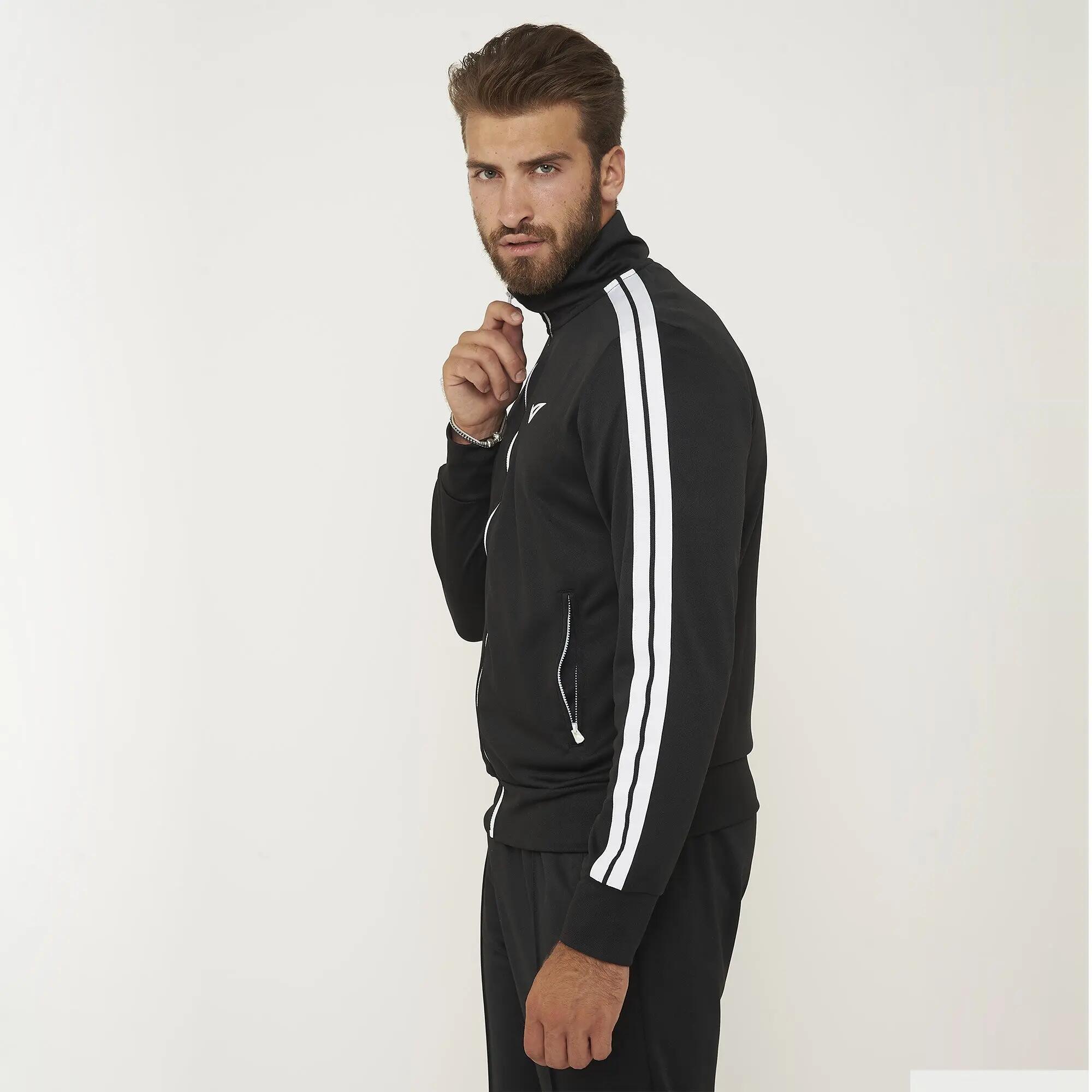 Chándal hombre Universal + Stellar Negro / Blanco 6/8