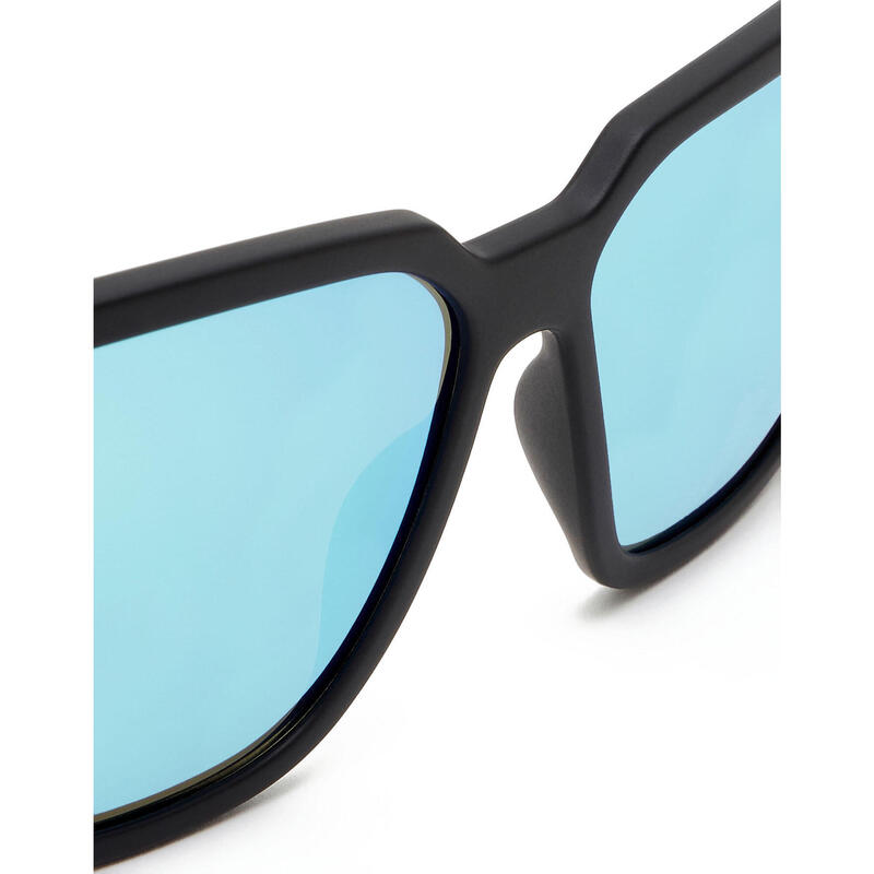 HAWKERS Zonnebrillen voor Mannen en Vrouwen MOTION Carbon Black Clear Blue