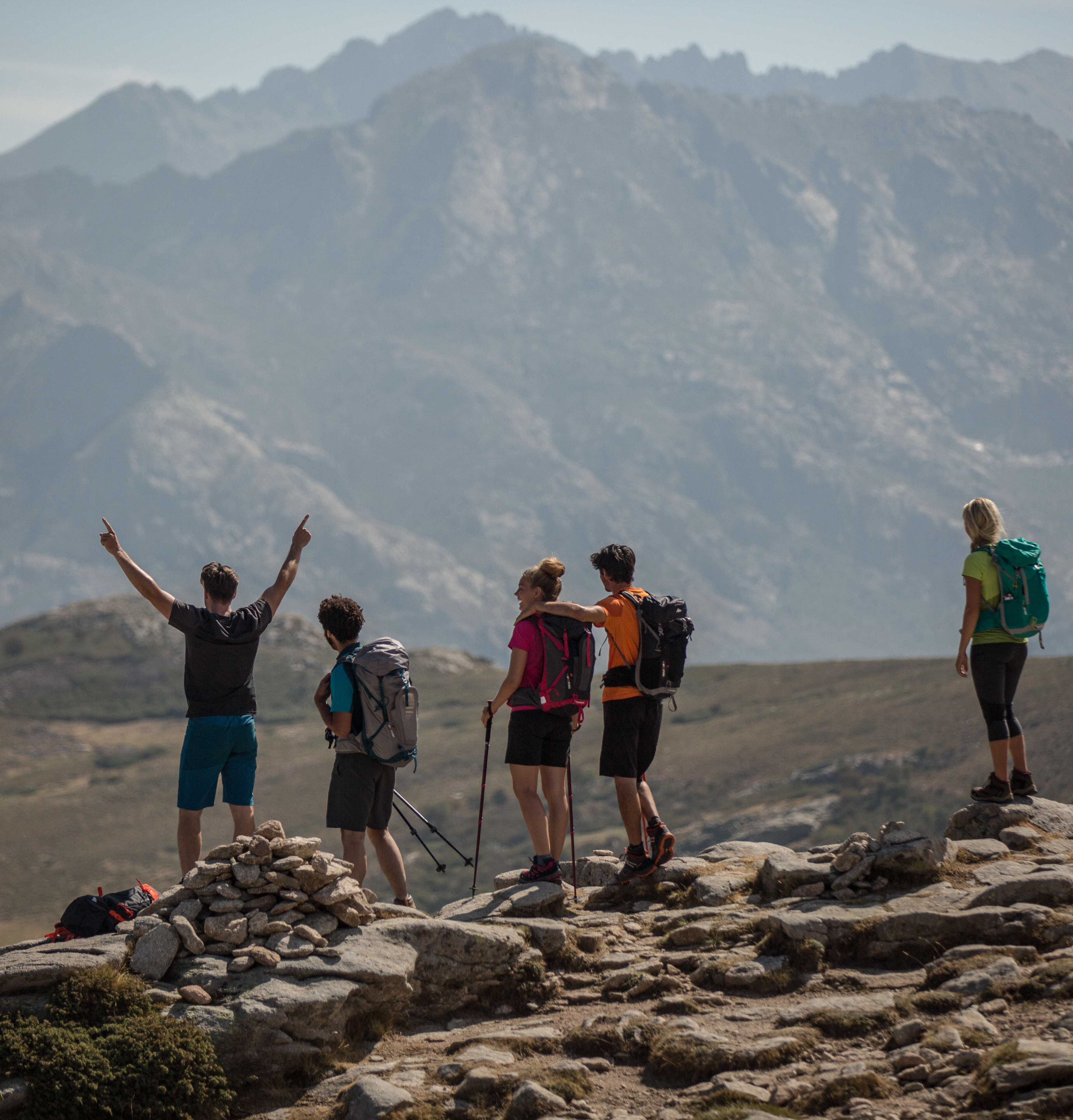 Where do I hang my hiking poles on a backpack? 