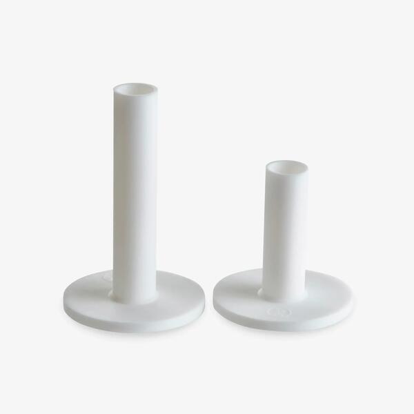 Two white silicone practice tees in two heights