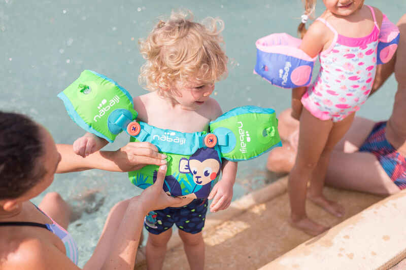 Green child's TISWIM adaptable armband-waistbands printed "MONKEY"