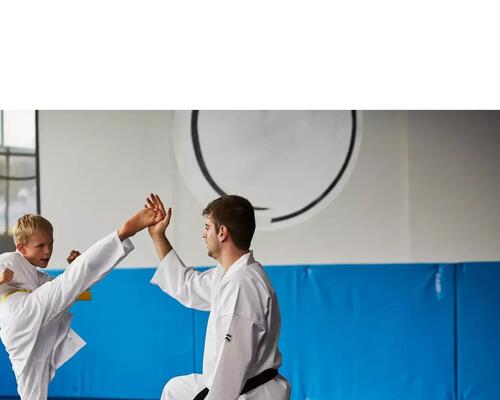 man and young boy practicing karate