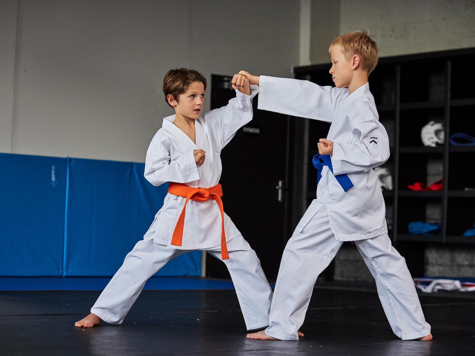 two young boys doing karate