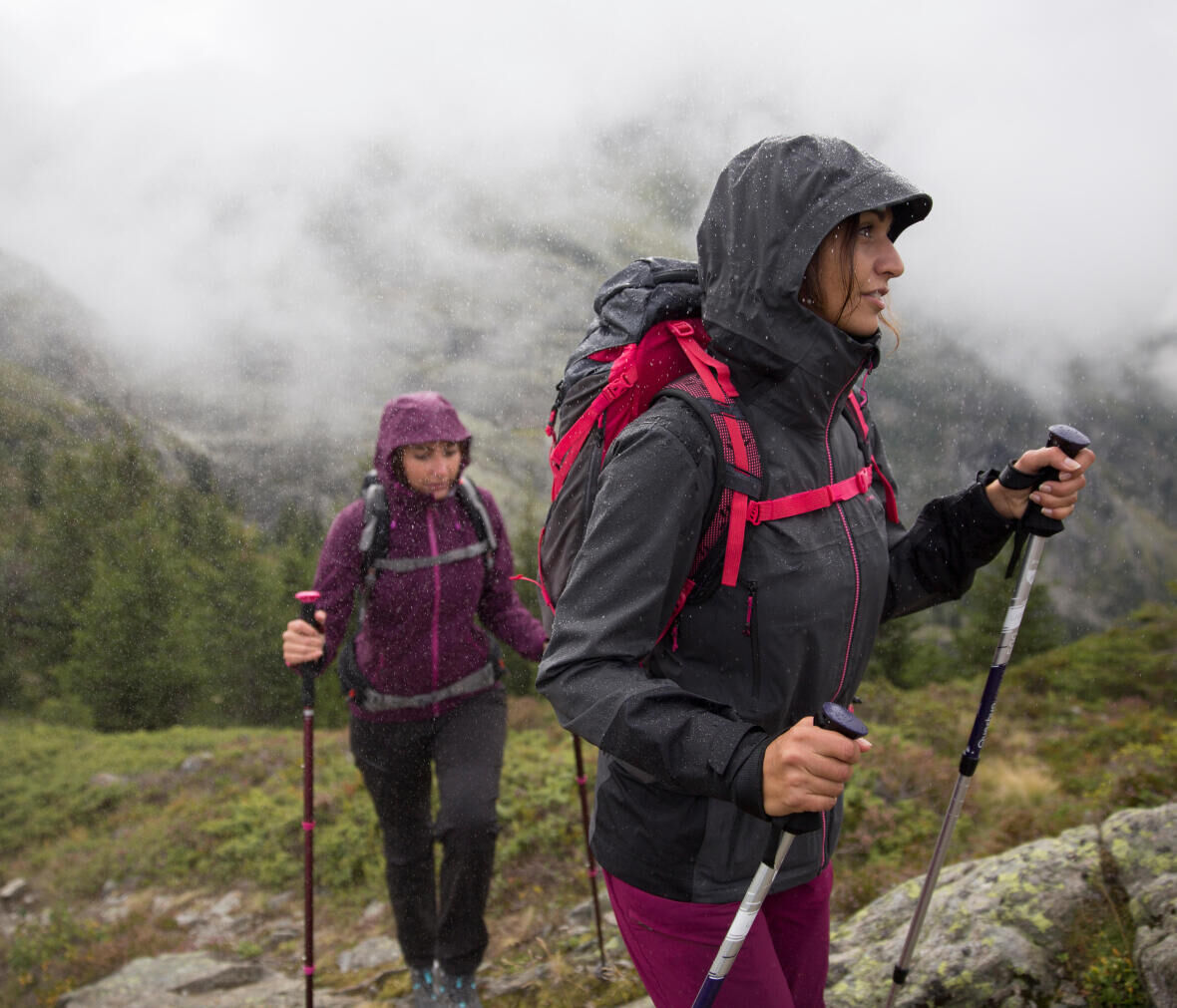two women mountain hiking with fog 