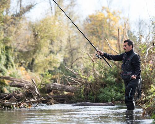 a man throwing his fishing line into the water