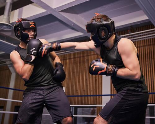 man hits the opponent with his boxing glove 