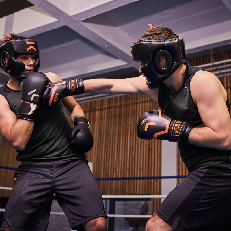 man hits the opponent with his boxing glove