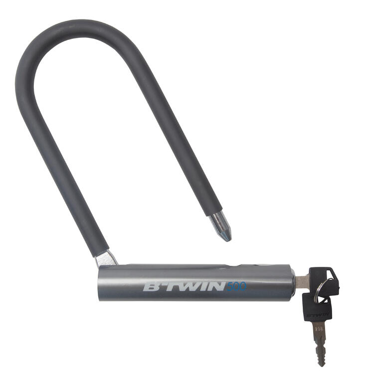 Grey D-lock bike lock with a rigid U-shaped steel shackle.
