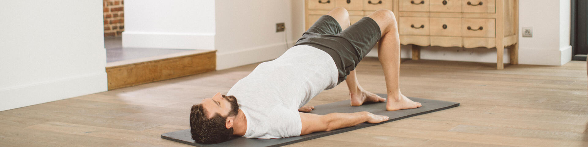man doing yoga on a mat