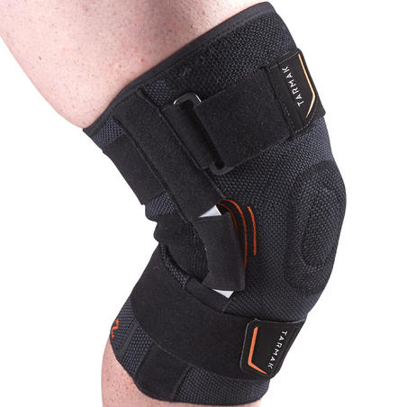 Genouillère de maintien ligamentaire gauche/droite homme/femme STRONG 700  noire - Decathlon