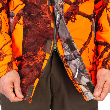 Куртка 100 для полювання, водонепроникна - Флуоресцентна/Камуфляжна