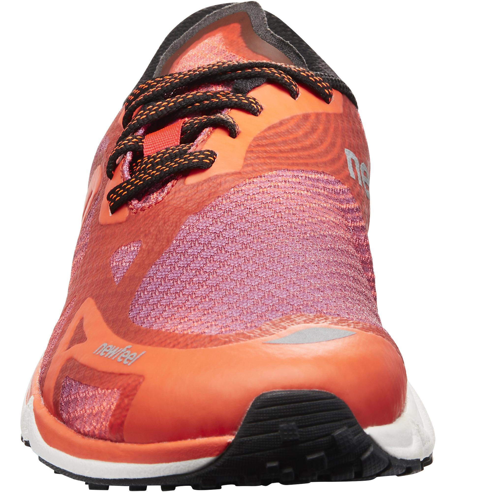 RW 900 athletic walking shoes in purple and orange