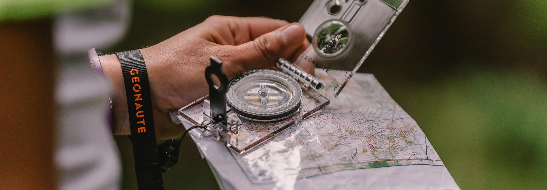 Man checking compass and map