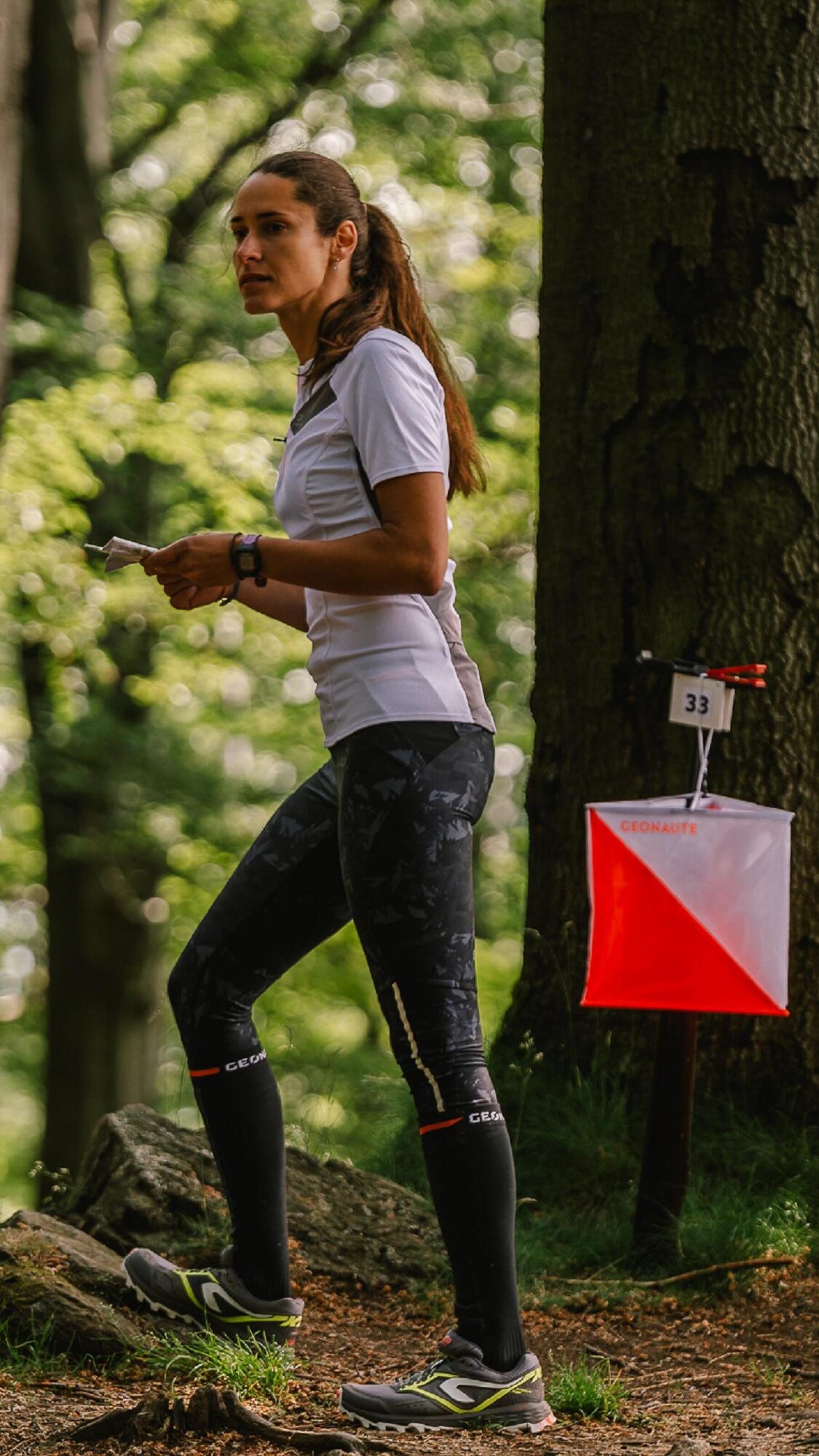 woman runs in the forest