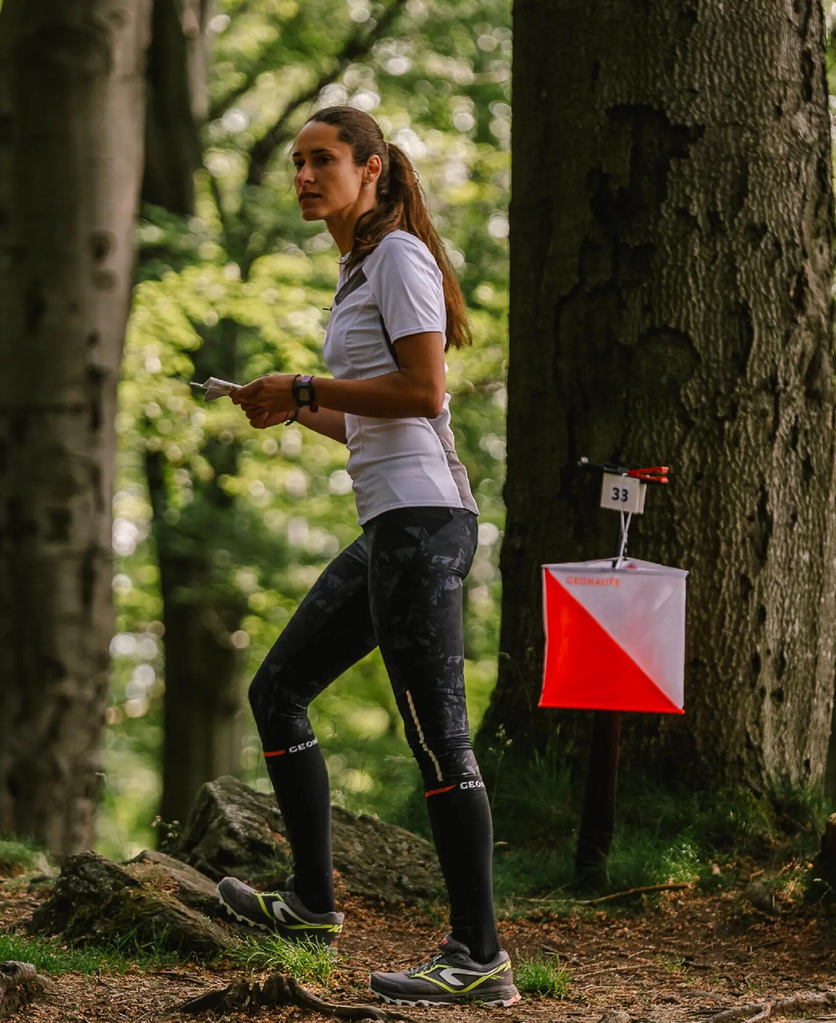 woman runs in the forest