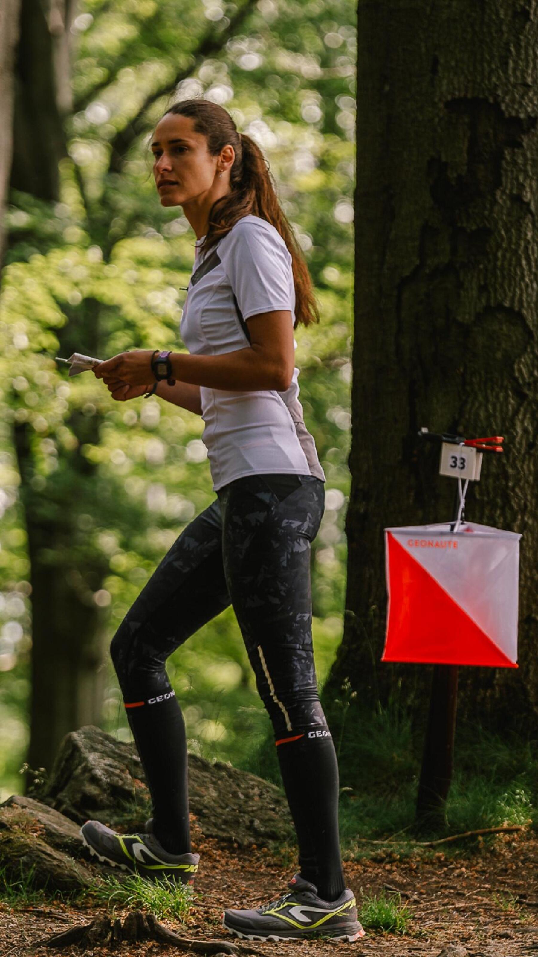 woman runs in the forest 