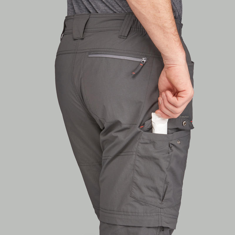 กางเกงขายาวผู้ชายแบบถอดขาได้สำหรับเทรคกิ้งบนภูเขารุ่น TREK 100 (สีเทาเข้ม)
