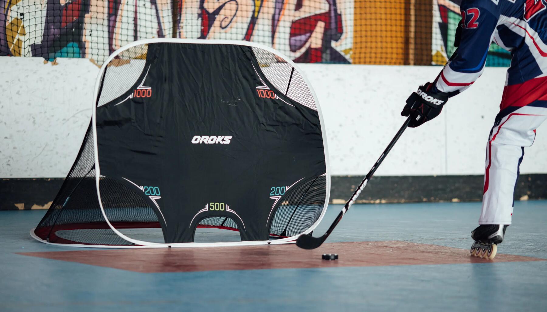 roller hockey player shooting in to a goal