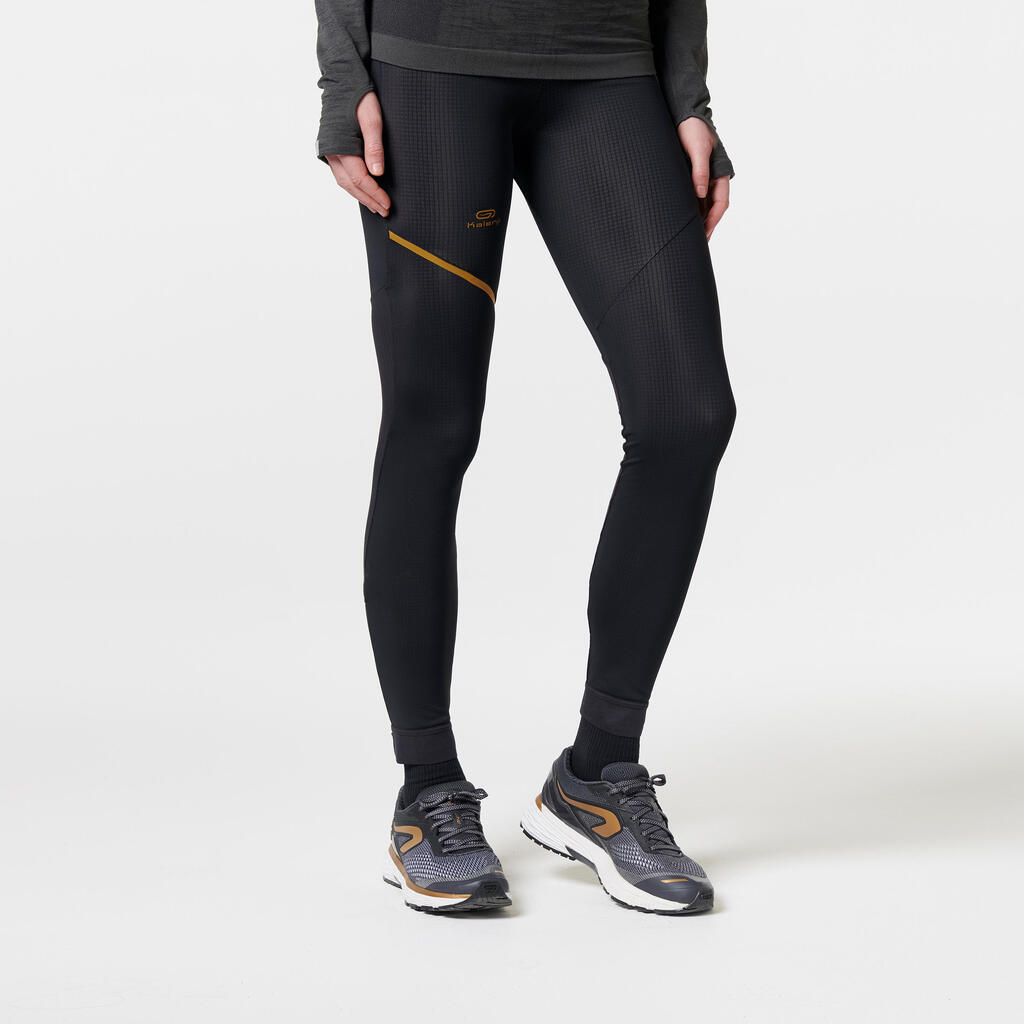 Laufhose lang Tights Kiprun Warm Damen schwarz/gold