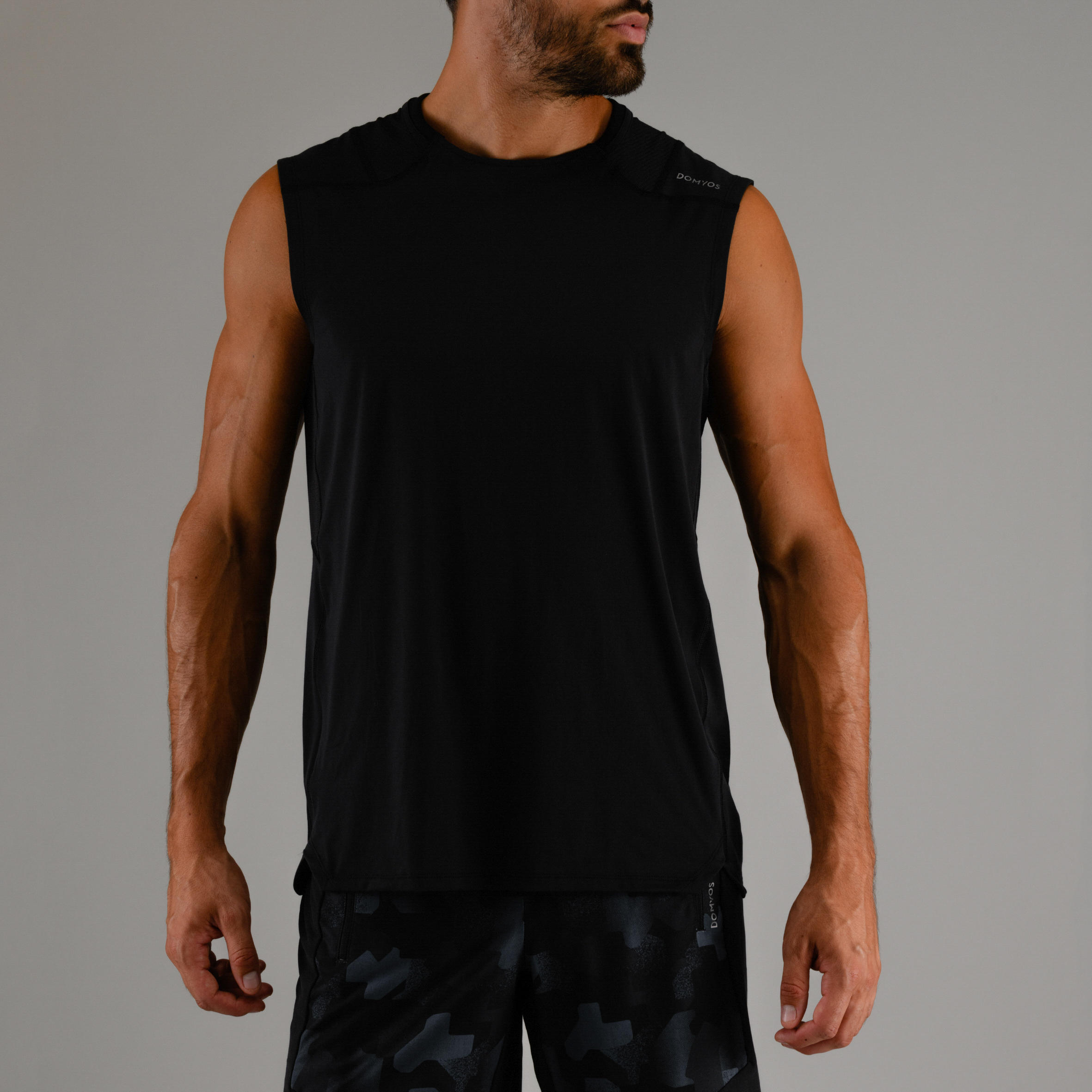 

Men's Sleeve less Rapid-Dry Cardio Gym Tank Top - Black -  By DOMYOS | Decathlon