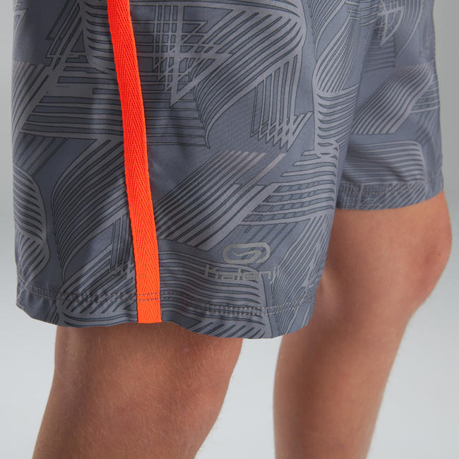 Children's baggy athletics shorts light grey neon red