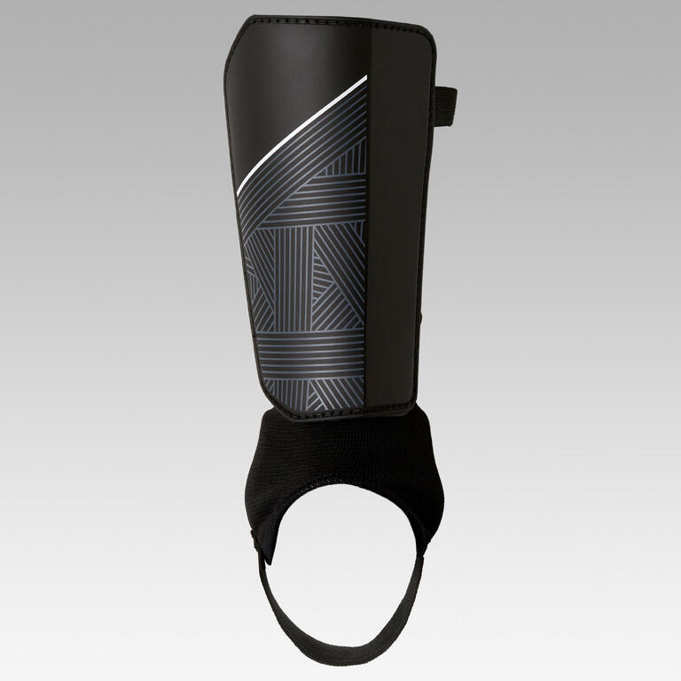 Black shin pad with ankle guard and elastic strap